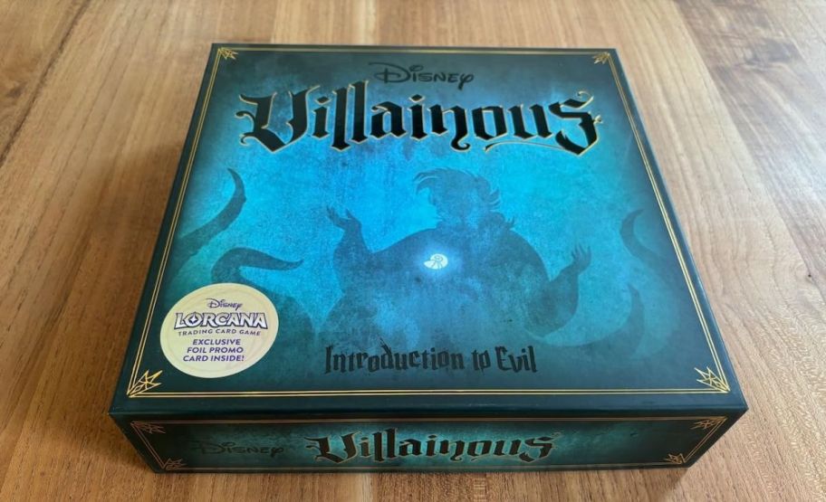 DIsney villainous board game box on a hardwood floor