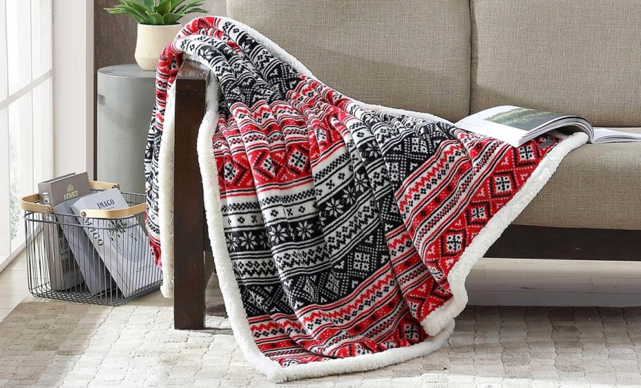 red and black fair isle print throw blanket draped over couch