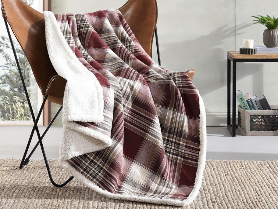 red plaid throw draped over a chair