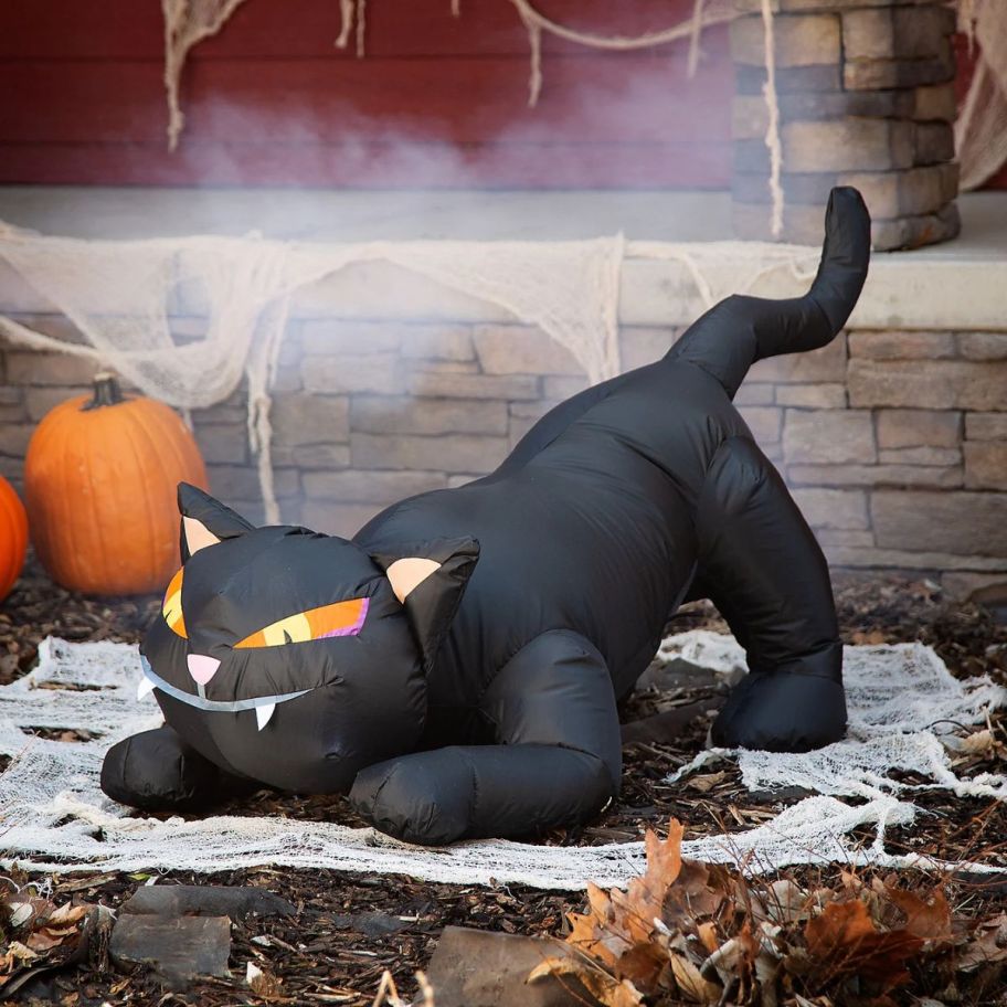 a large crouching black cat halloween inflatable