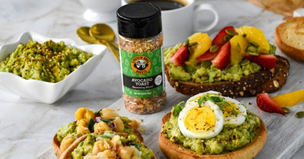 Einstein Bros. Bagels Avocado Toast Seasoning 5.4oz Bottle shown on toast and bagels