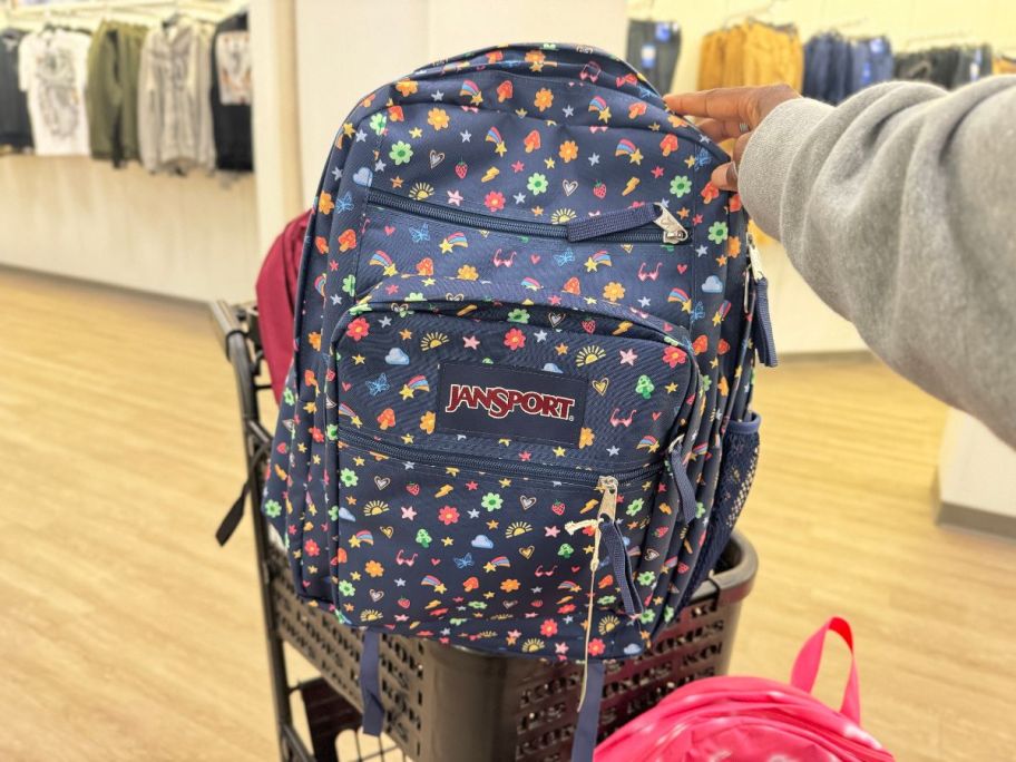 JanSport Big Student Backpack in Slice in hand in store