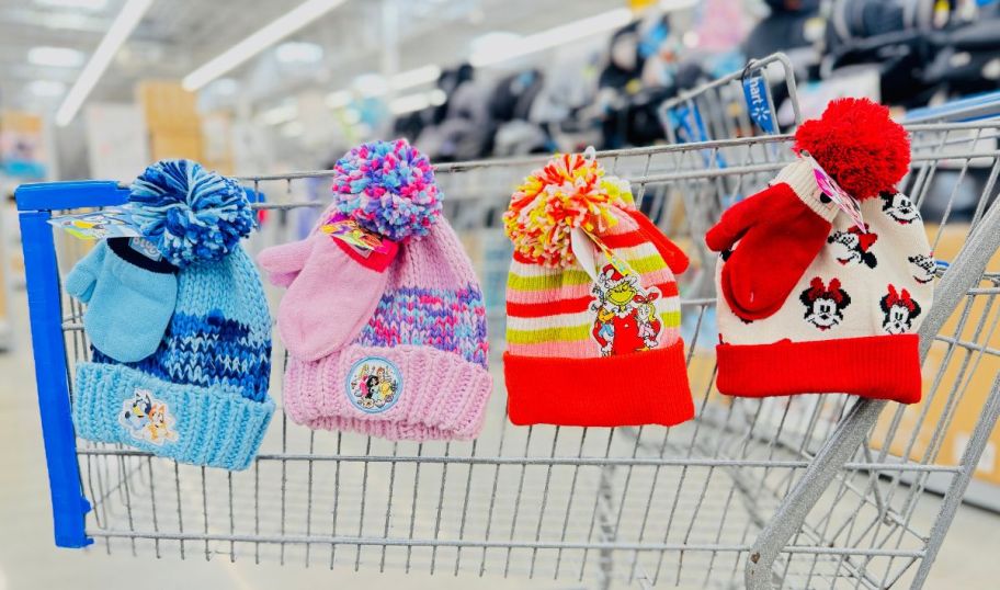 four kids character beanies with mittens sets on the side of a shopping cart