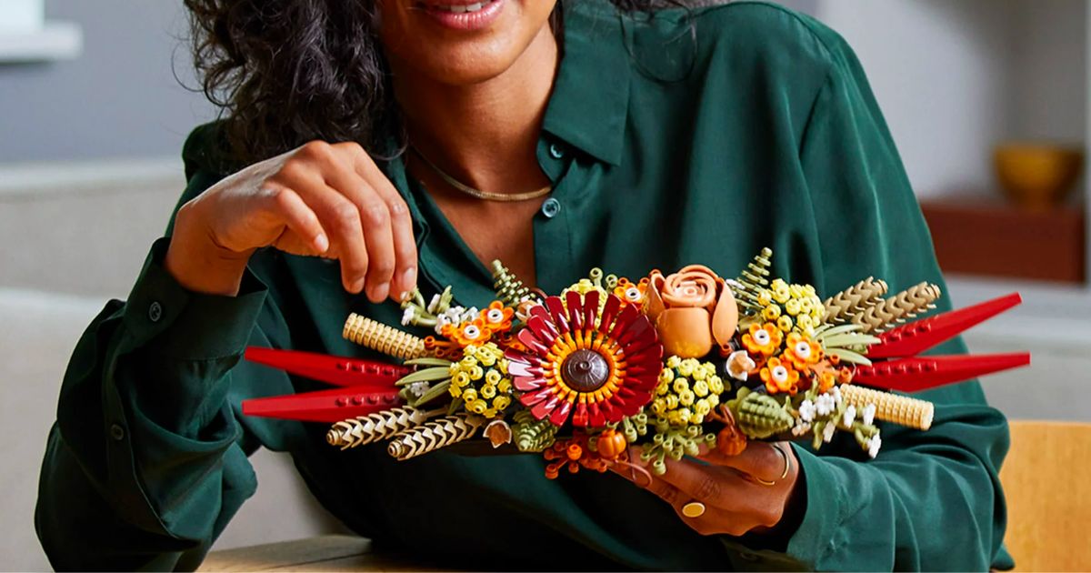 a woman building a LEGO dried botanicals set