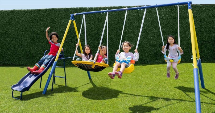 Kids playing on a Sportspower Super Flyer Swing Set