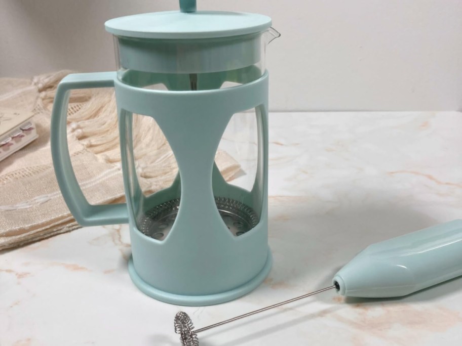 Tasty-French-Press-and-Frother-Coffee-Set displayed on yop of a table