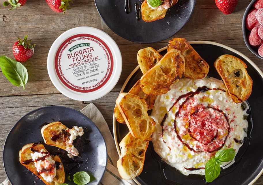 Trader Joes Stracciatella Burrata filling on table with italian appetizers