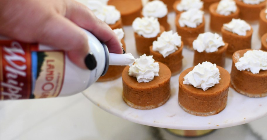 adding whipping cream to pumpkin pie bites