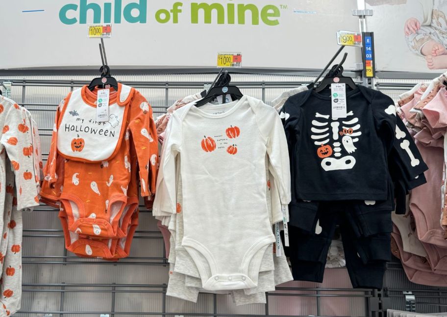 3 halloween onsies on a store aisle