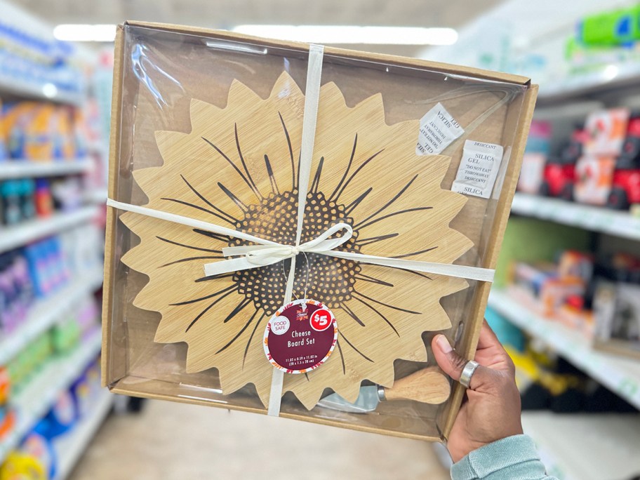 hand holding sunflower cheese board