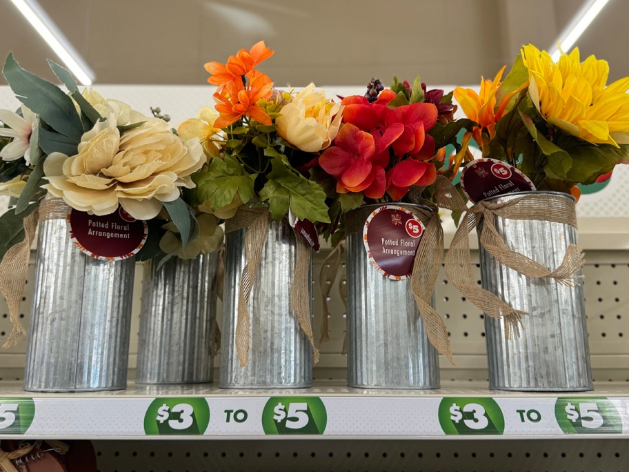 fall flowers in vase on shelf 