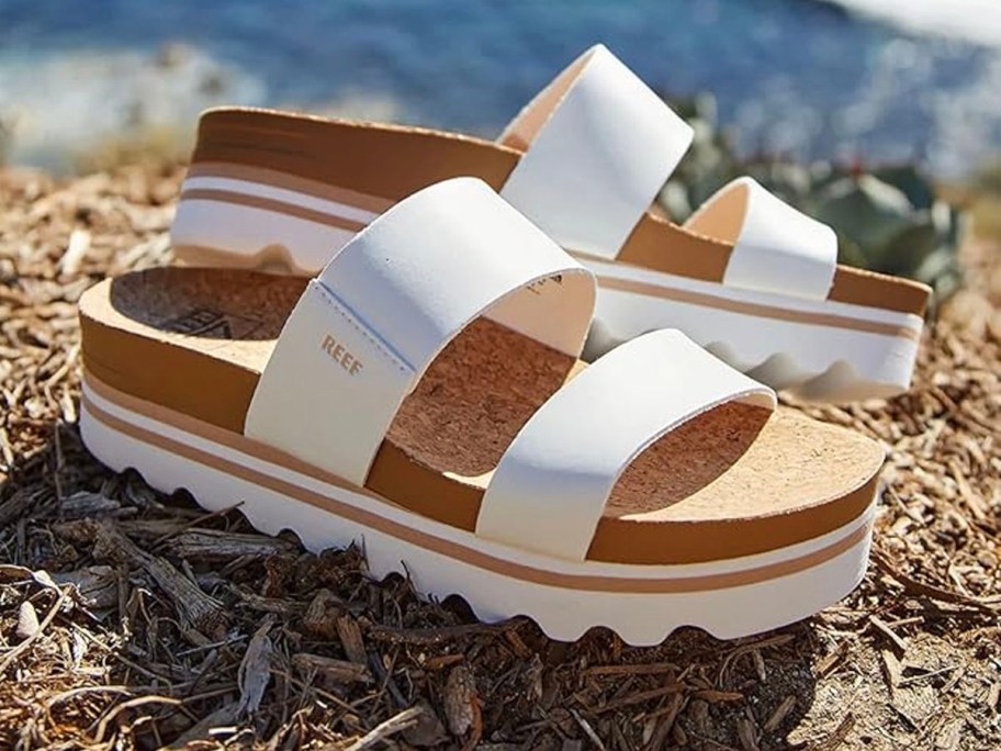 white platform sandals sitting on hill 