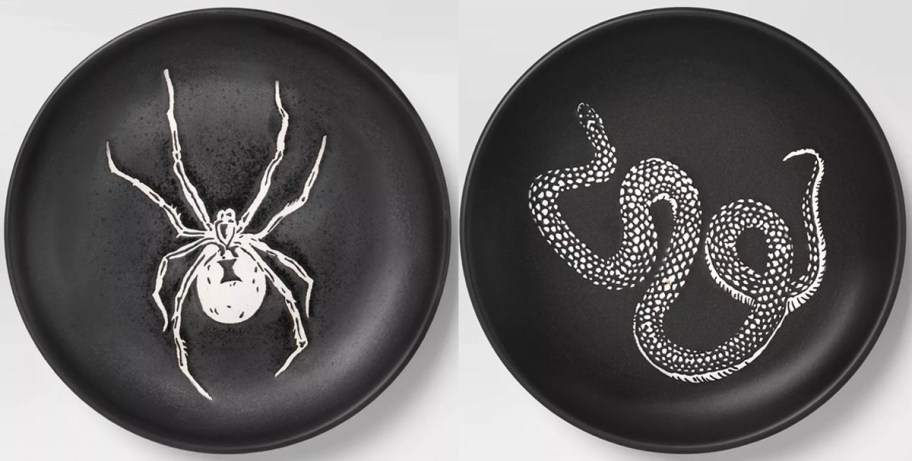 two black plates with spider and snake on them