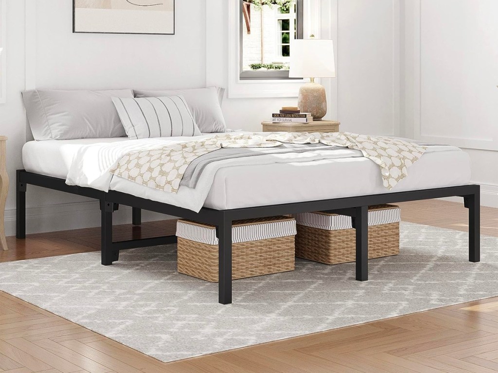 black full bedframe with bedding 