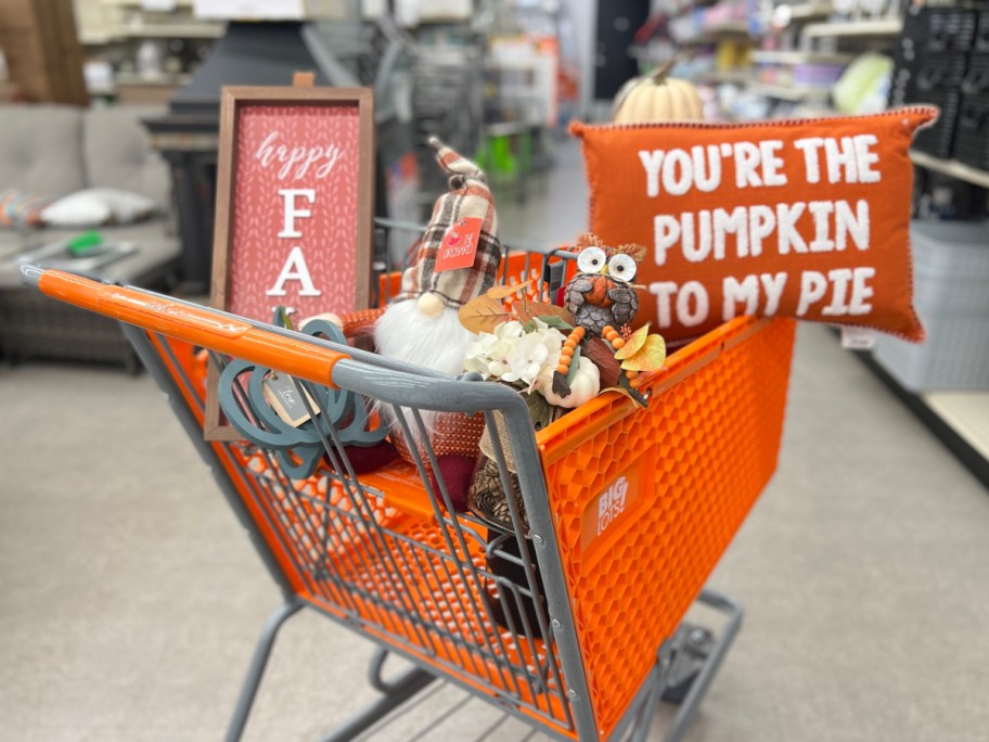 orange Big Lots Shopping Cart filled with halloween and fall items