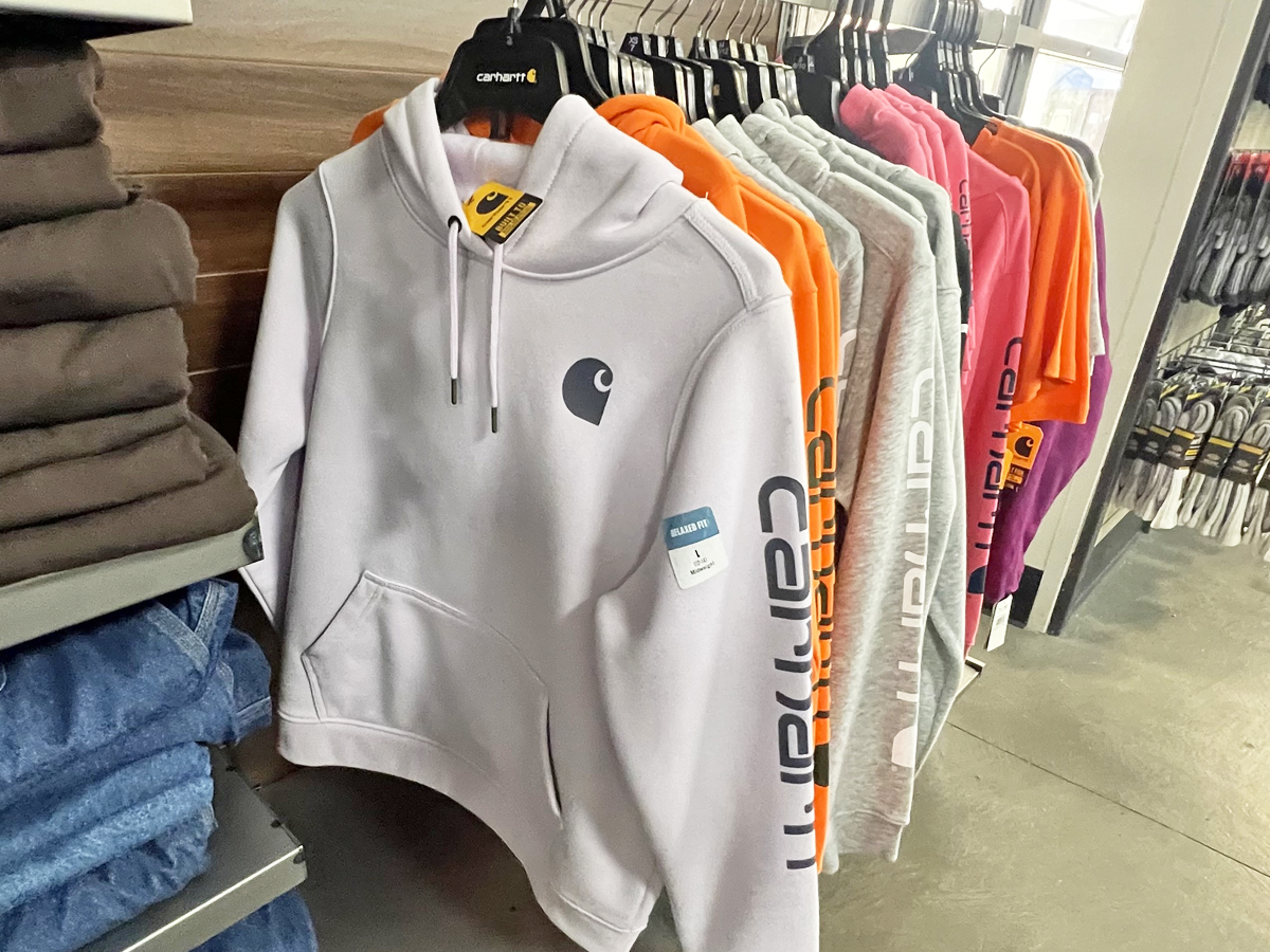 women's carhartt hoodies on store display rack