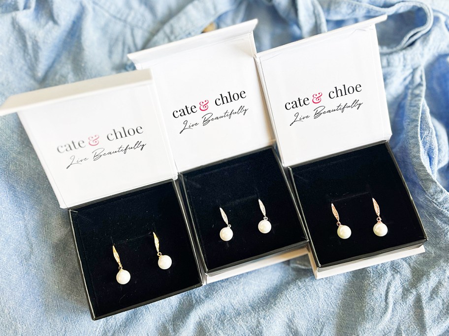 three boxes of pearl earrings