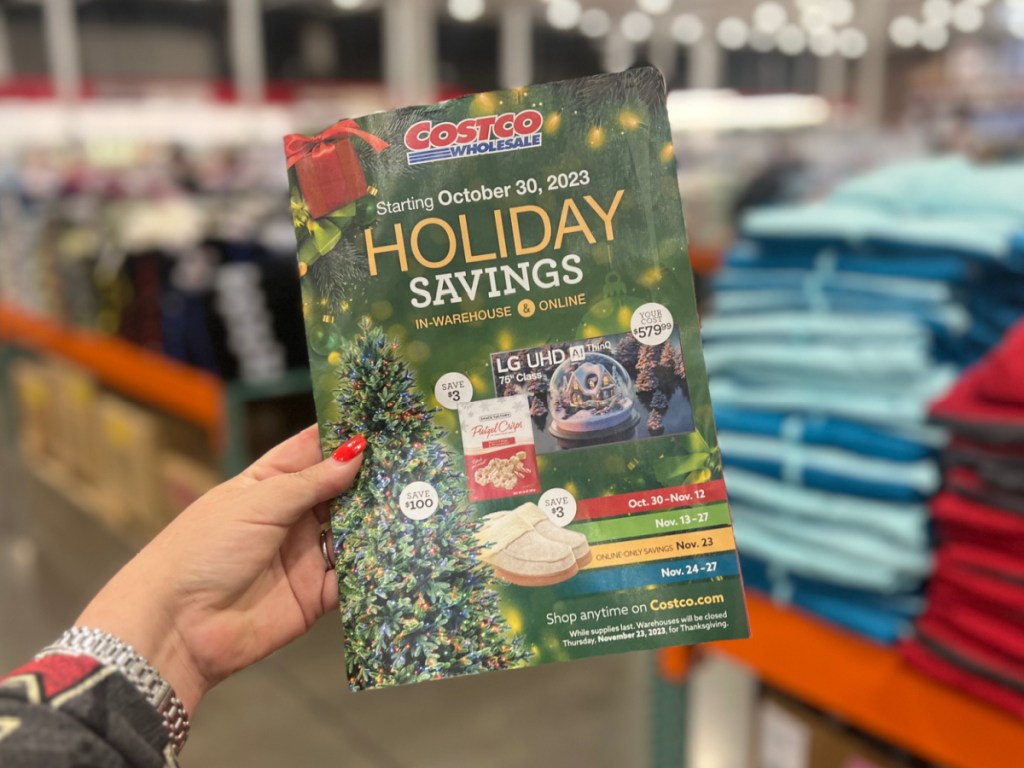 Costco-holiday-book-in-womans-hand-at-the-store.jpg