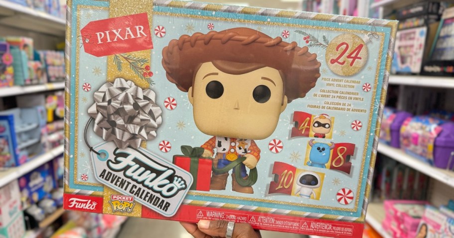 hand holding a Funko POP! Pixar Advent Calendar box