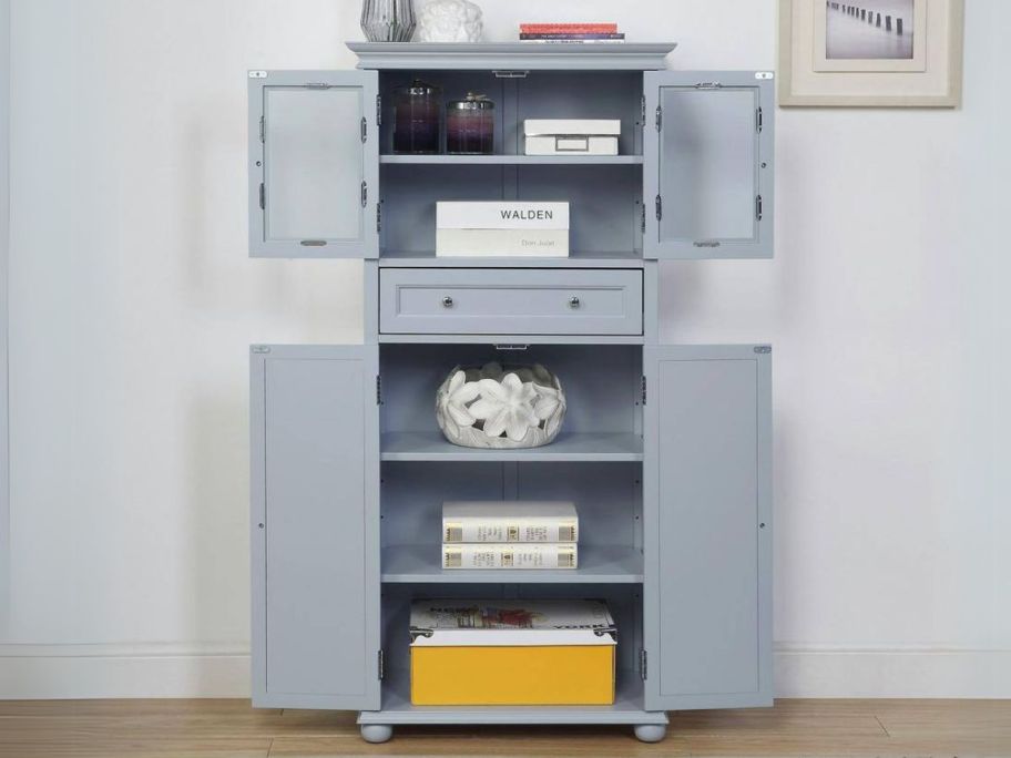 gray linen cabinet shown with both doors open