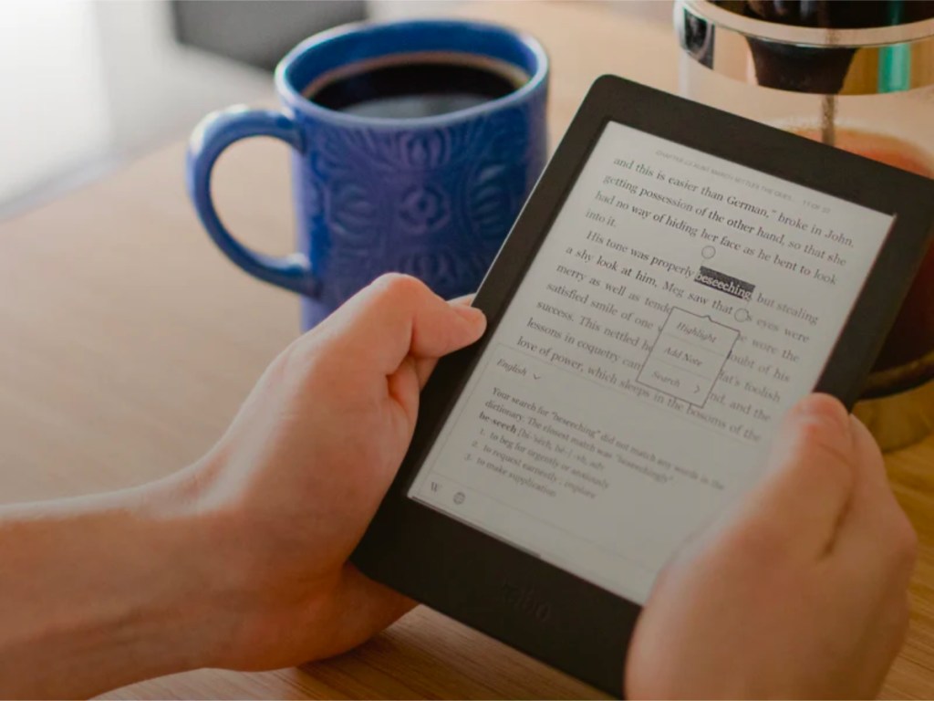 ereader with book and cup on coffee