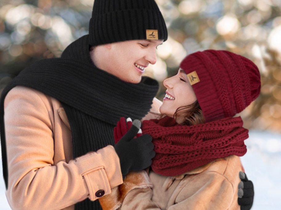 A man and a woman wearing a hat and glove sets