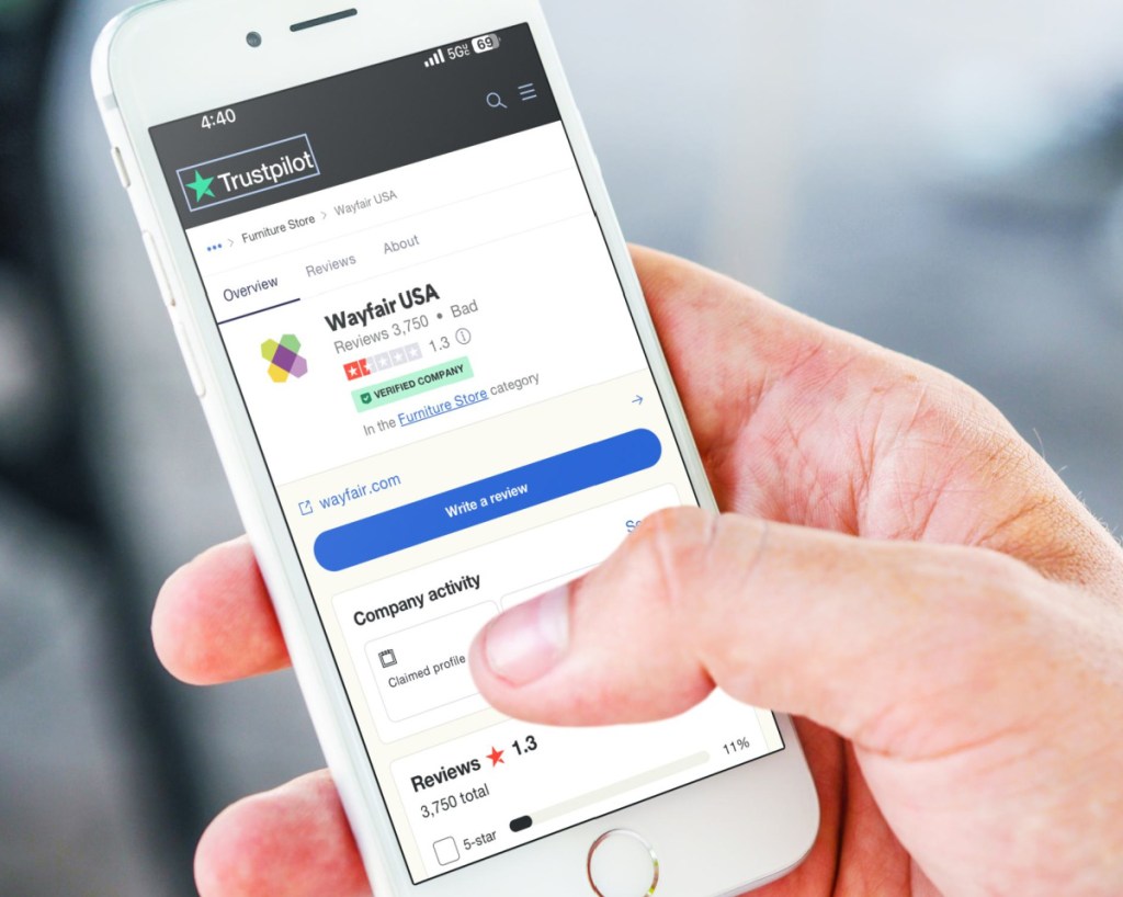 TrustPilot rating with wayfair reviews shown on a telephone