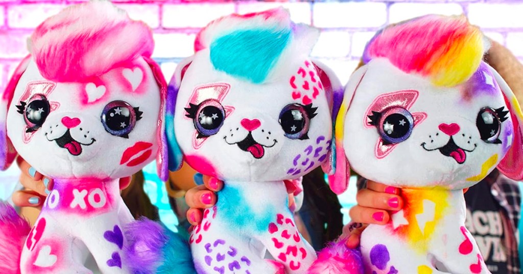 three dog plush toys that have been airbrushed