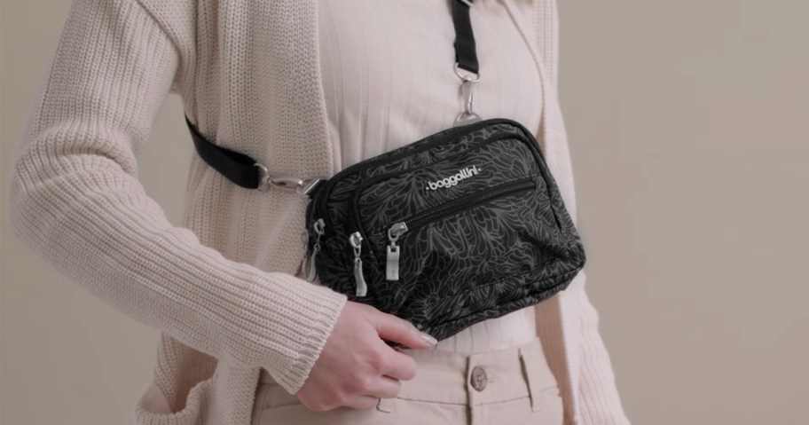 woman wearing black triple zip crossbody