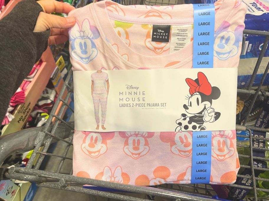 hand holding minnie pj set in cart