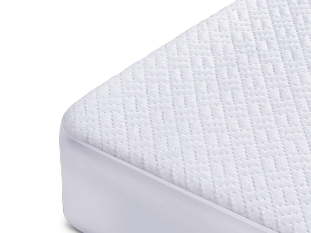 close up of white mattress protector on the bed