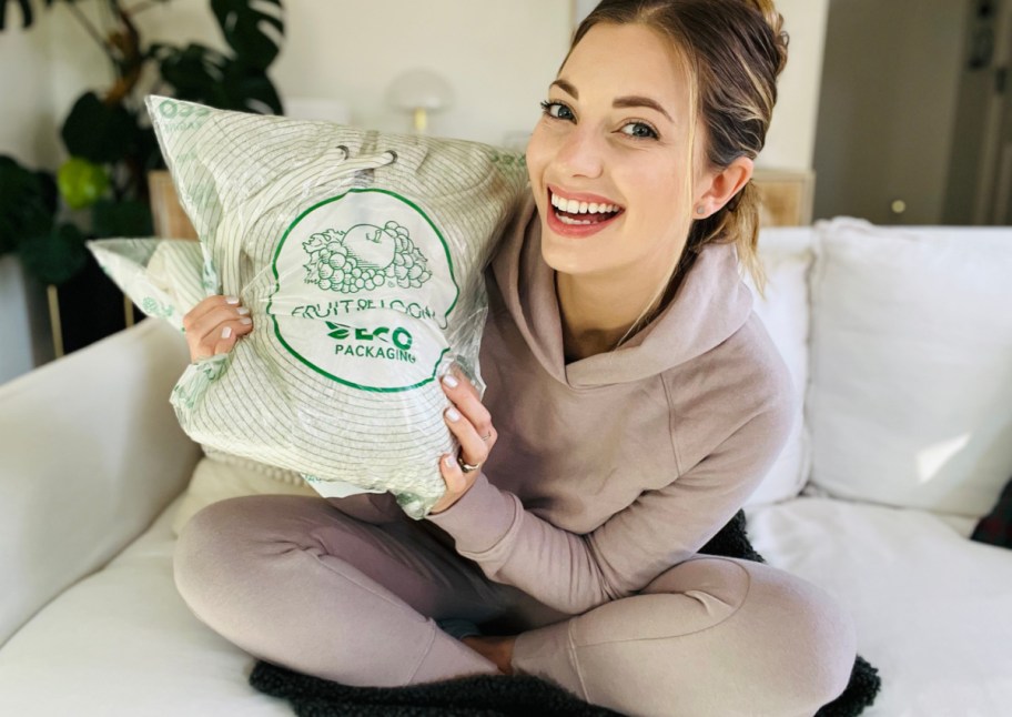 woman holding fruit of the loom package