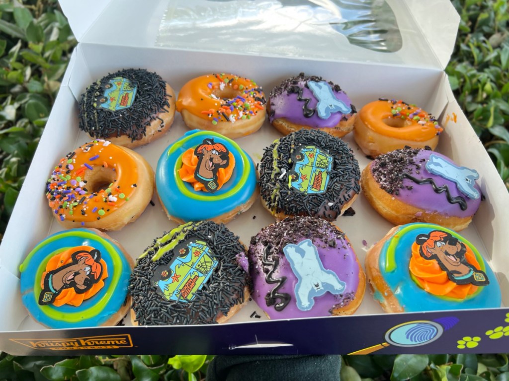 hand holding Krispy Kreme Scooby doo donuts