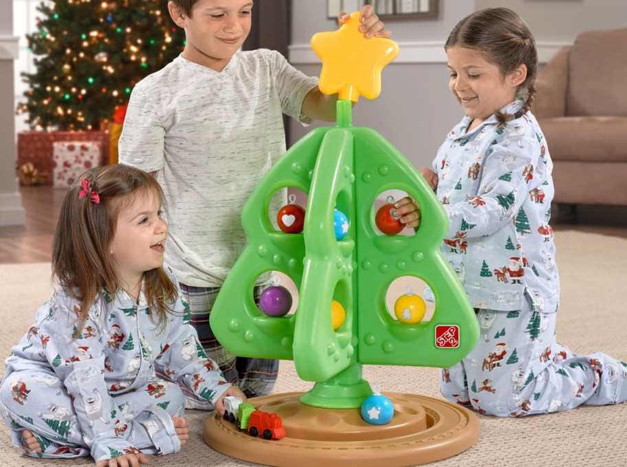 kids playing with their step2 Christmas tree