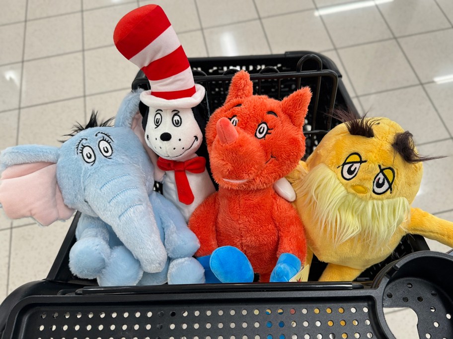 a variety of Dr Seuss character plushes in a Kohl's shopping cart