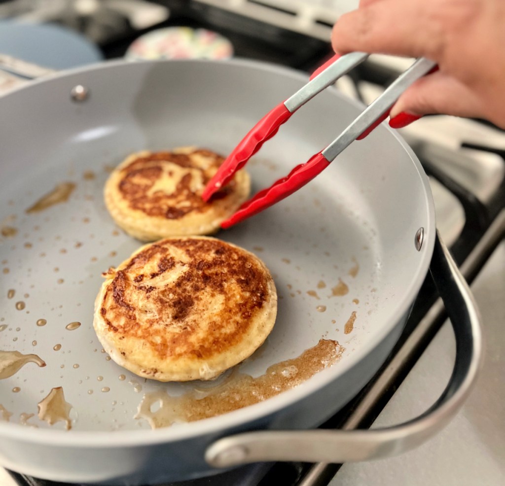 making uncrustables french toast on a skillet