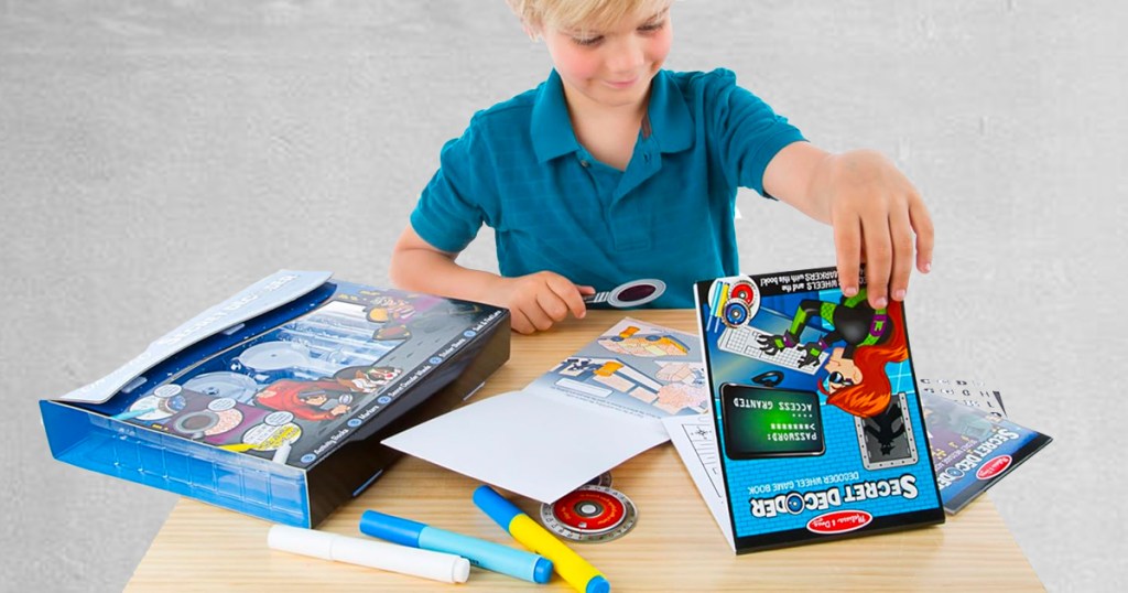 boy playing with melissa and doug decoder kit