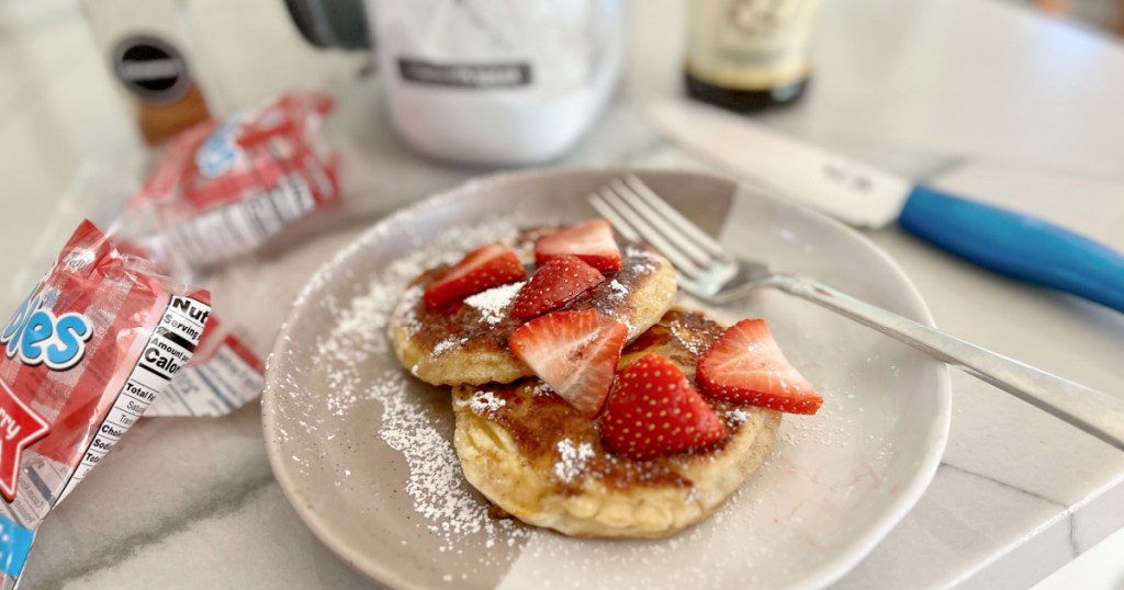 plate with uncrustables french toast and fresh strawberries 