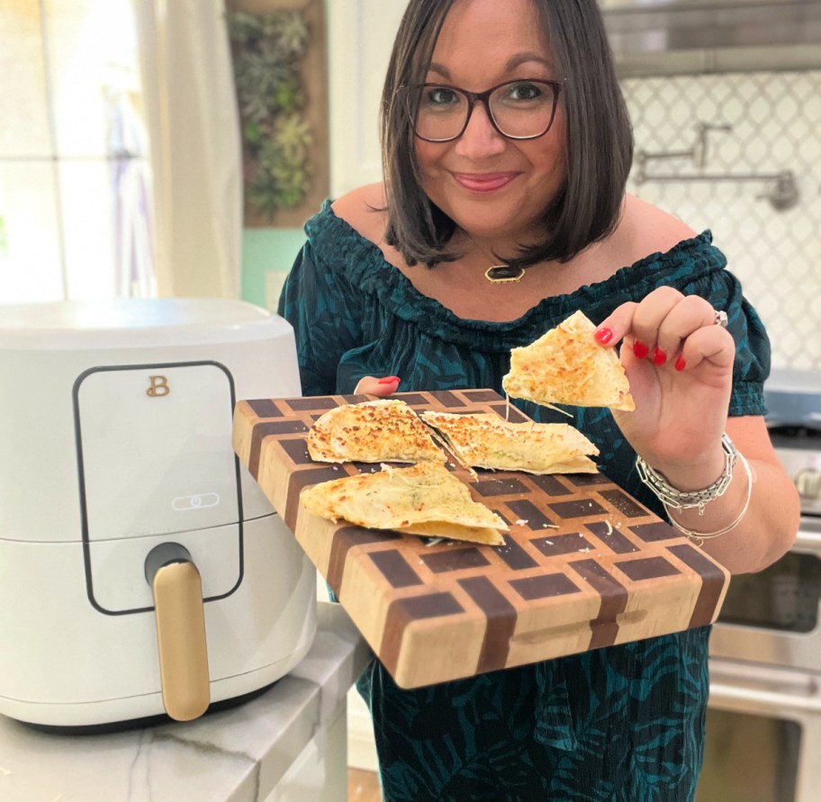 woman cooking tortilla garlic bread in the air fryer