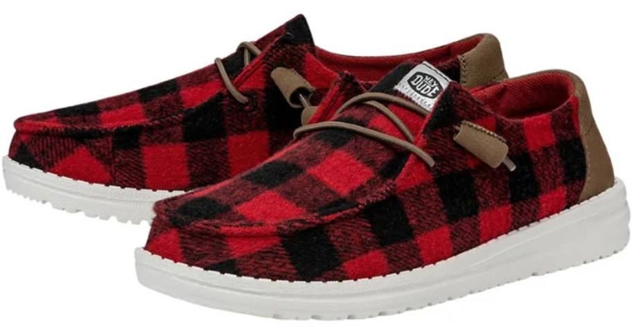 pair of black and red buffalo plaid print heydude shoes