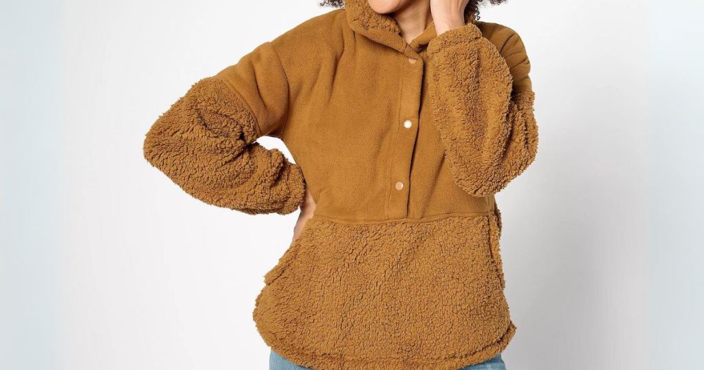 woman wearing a brown color sherpa pullover