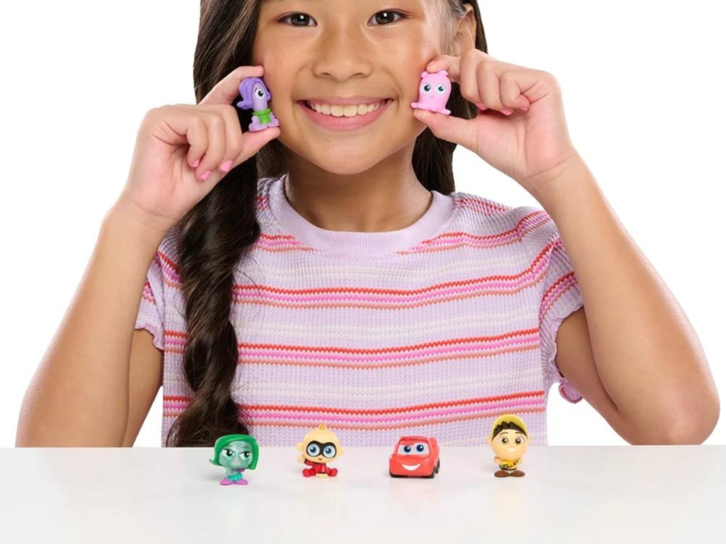 Girl playing with Doorable Figurines