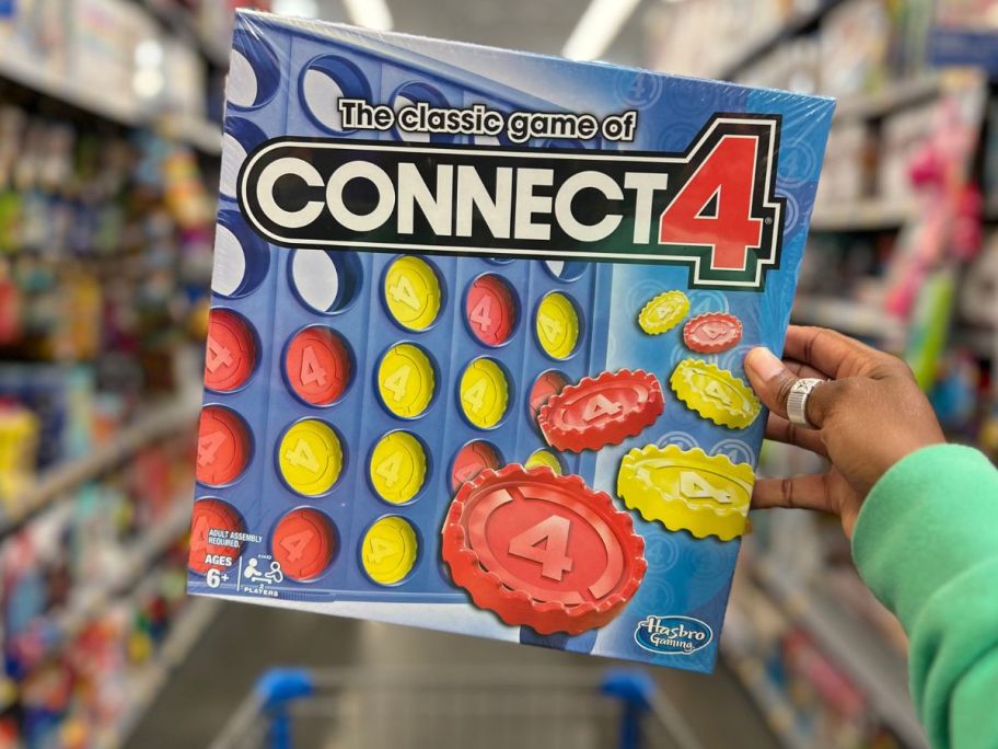 hand holding up Connect 4 Game