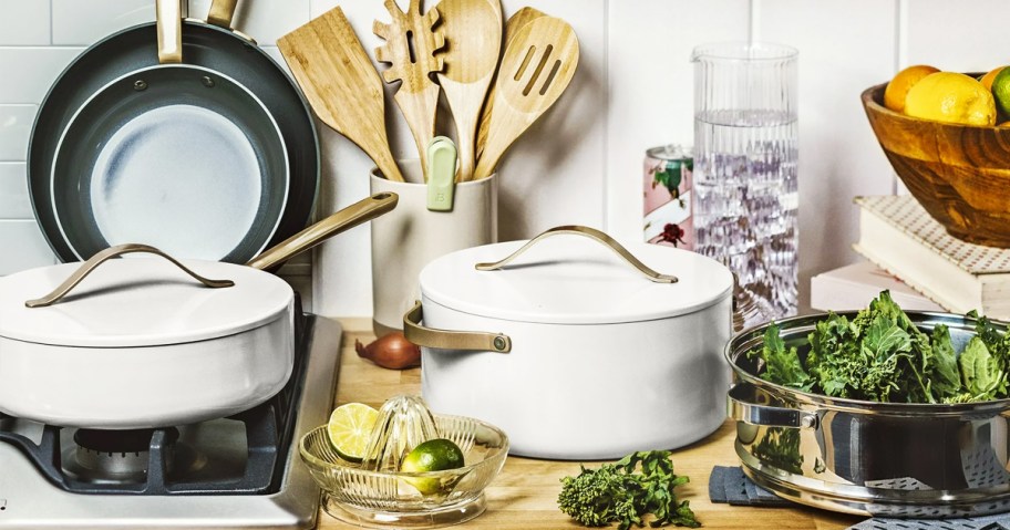 white and gold cookware set on stove