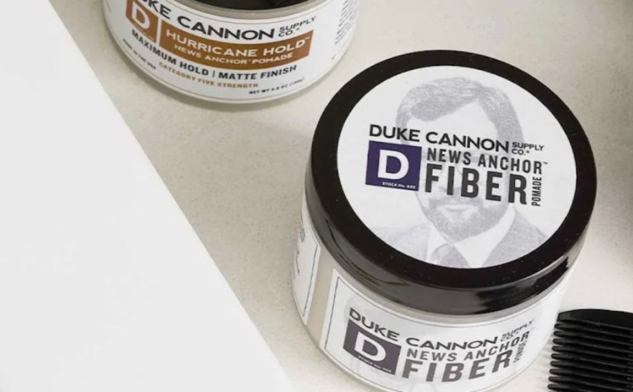 jar of duke cannon pomade on bathroom countertop