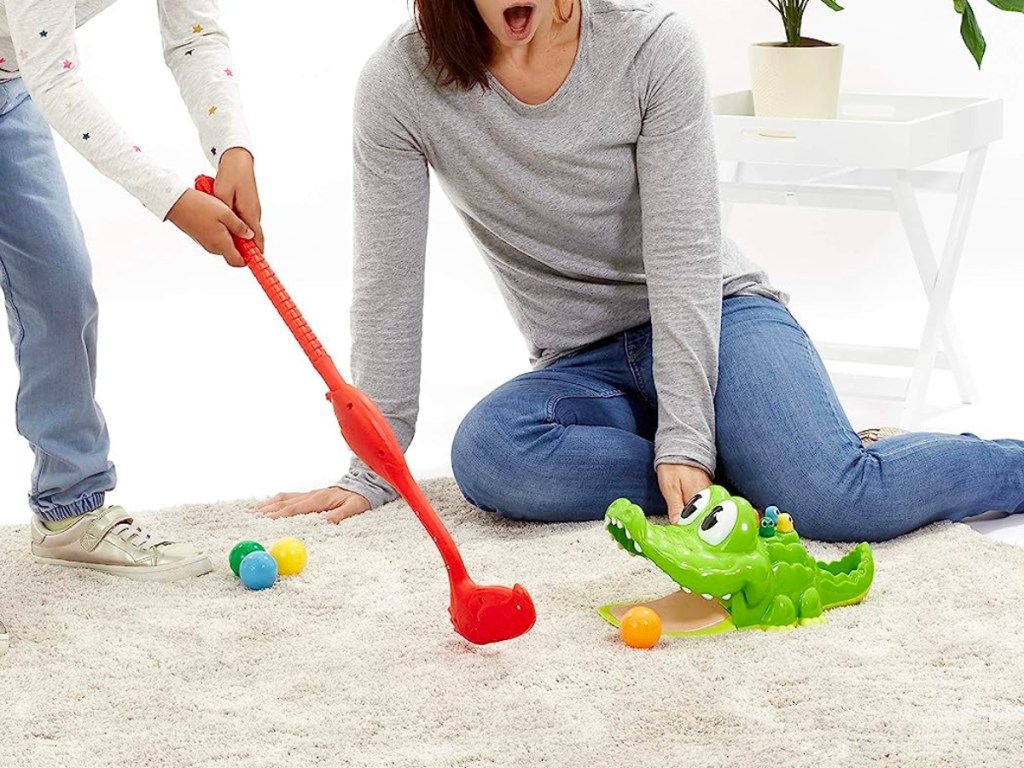 kids playing with gator golf game