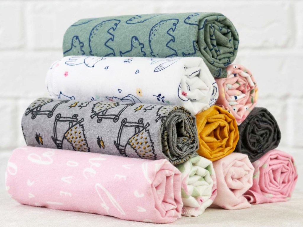 stack of rolled flannel baby blankets