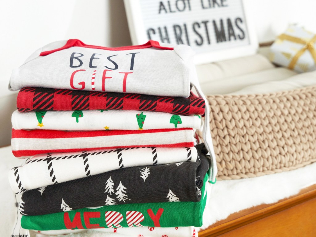 stack of christmas baby bodysuits