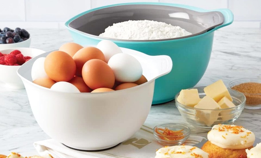 grey, white, and teal mixing bowls set on kitchen counter