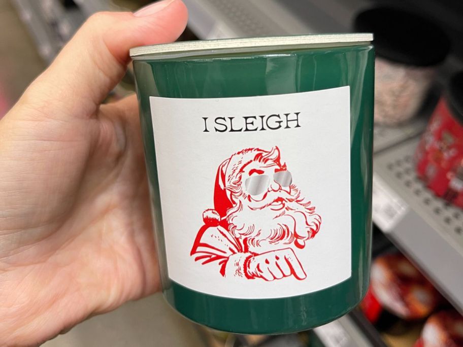 Mainstays "I Sleigh" Dirty Santa Scented Candle 6oz in hand in store